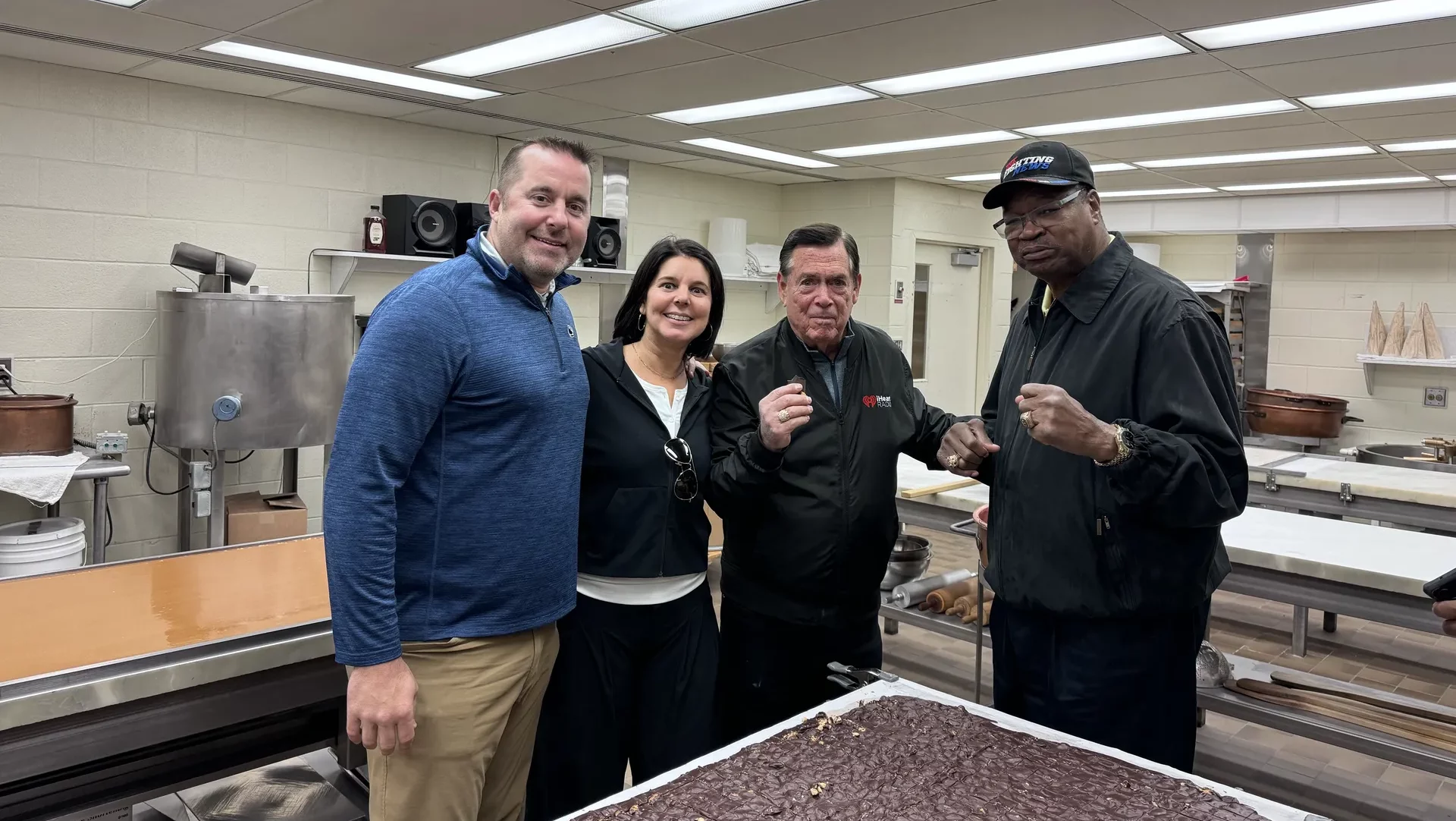 josh early candy owners barry dobil jr and sister Amy Barnett pose for a photo with larry holmes and mike mittman
